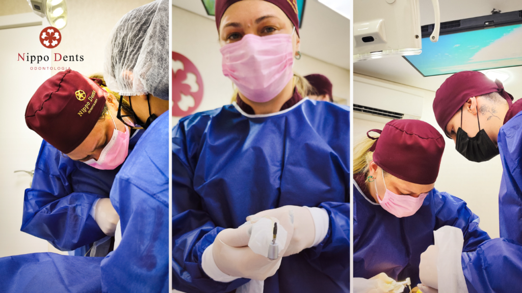 Equipe odontológica em centro cirúrgico realizando instalação de implantes dentários